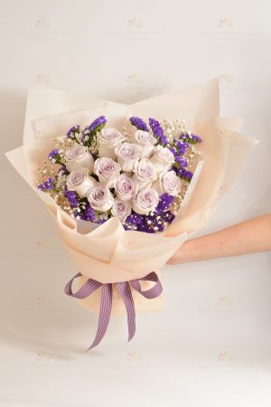 My love for you is increasing day by day (12 purple roses, gypsophila)