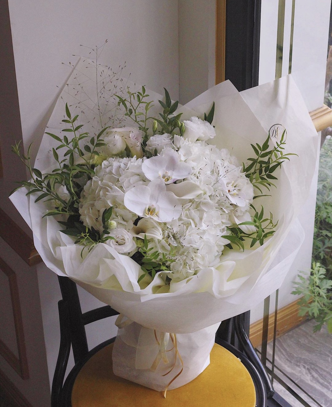 Pure and precious (white phalaenopsis, white hydrangea, white calla orchid, white platycodon, smoke grass, seasonal leaves)