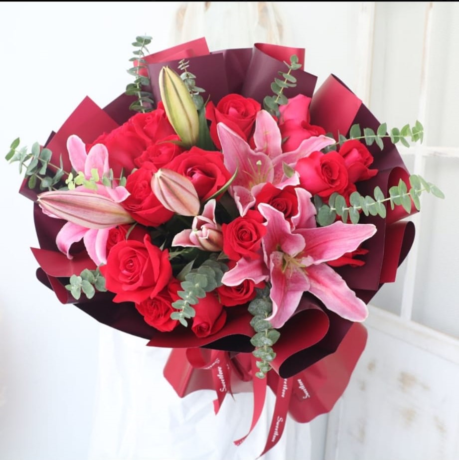 Reunion and Harmony (imported red rose, pink lily, eucalyptus)